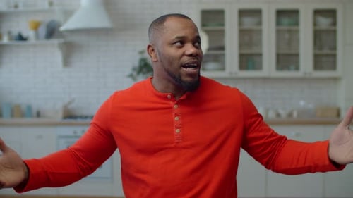 Person Presenting to Camera in Modern Kitchen