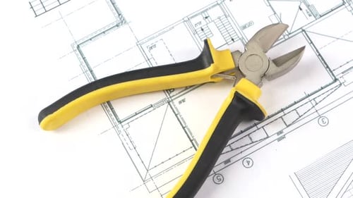 Cutting Pliers on Building Plan, Scheme, Rotation