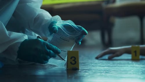 Forensic Investigator Collects Evidence at Crime Scene