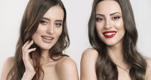 Two Glamorous Women with Beautiful Makeup Posing