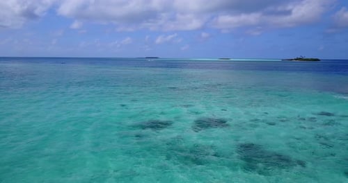 Beautiful drone abstract shot of a white sandy paradise beach and aqua turquoise water background in