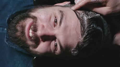 Man Getting Hair Washed at a Salon