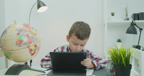Kid Boy Doing School Homework with Tutor