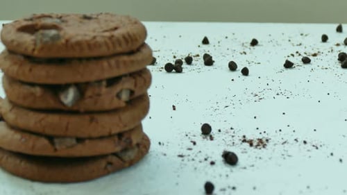Stacked Chocolate Chip Cookies on White Surface