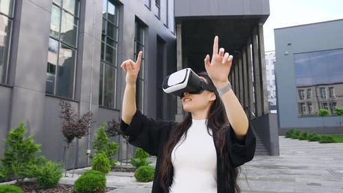 Woman Using VR Headset in Urban Setting