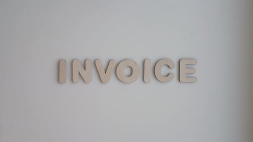 Invoice Spelled Out in Wood Letters