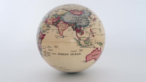 World Globe Rotating on a White Background