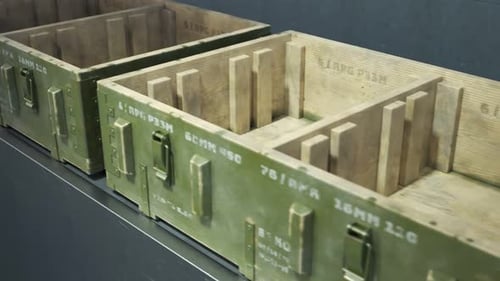 Packing military boxes with RPG missiles. Factory line. Loopable. 4KHD