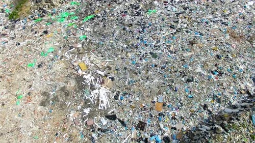 The huge garbage dump on the outskirts of the forest, view from drone