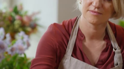 Flower shop owner doing bookkeeping