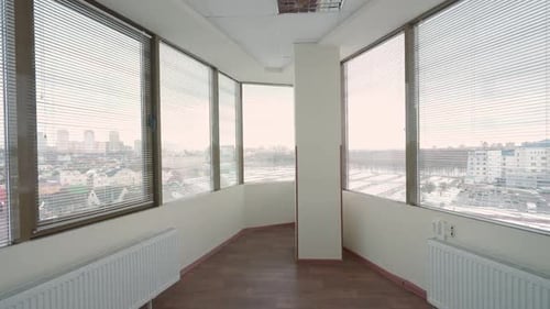 Inside a Skyscraper the Interior of an Empty Office Space with Panoramic Windows a Walk Through the