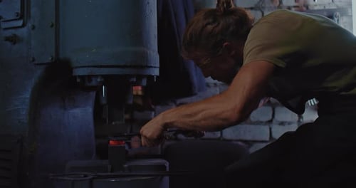 Master is Processing Metal Workpiece By Automatic Forging Hammer in Workshop Prores