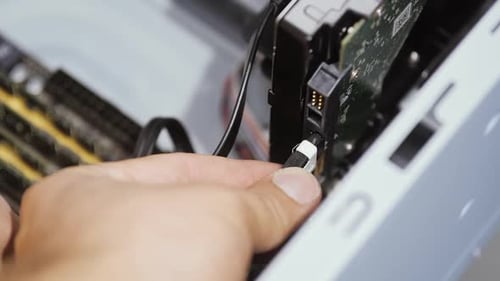 Hand Connecting Electronic Component Inside Computer Tower