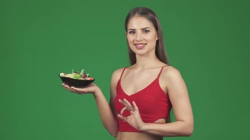 Smiling Woman Holding Salad Bowl on Green Screen