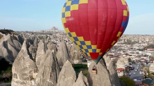 Hot Air Balloon Drifting over Cappadocia Landscape