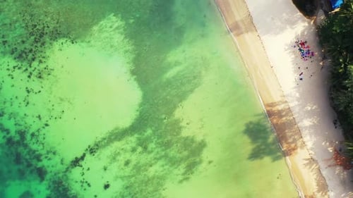 Aerial flying over panorama of luxury shore beach vacation by blue sea with white sand background of