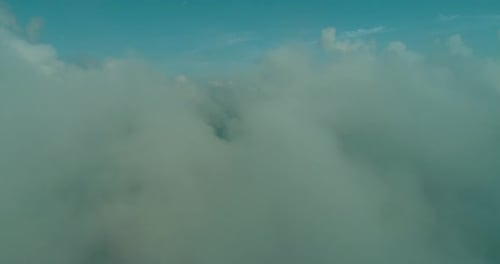 Aerial Fly Above Clouds with Blue Sky in Backgroubnd on Beautiful Sunny Day