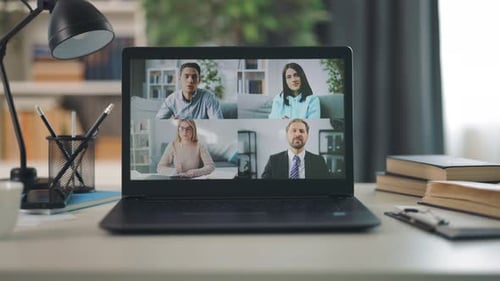 Laptop Video Call with Coworkers in Home Office