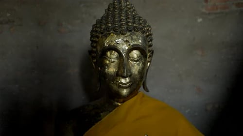 Buddha Statues Draped in Yellow at Wat Yai Chai Mongkhon in Ayutthaya Thailand Pushback Shot
