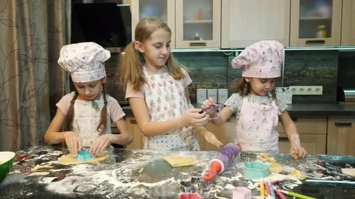 Girls making cookies together