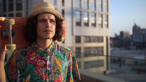 Stylish Young Adult with Skateboard in City