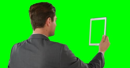 Man Using Tablet with Chroma Key Background