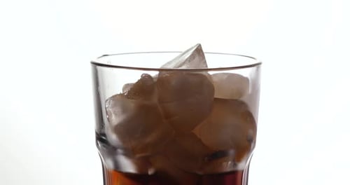 Soda Poured Over Ice Close Up