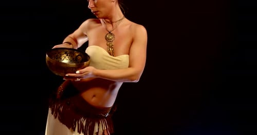 Woman Poses with Metal Bowl in Studio