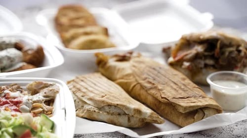 Variety of Takeout Food in White Containers