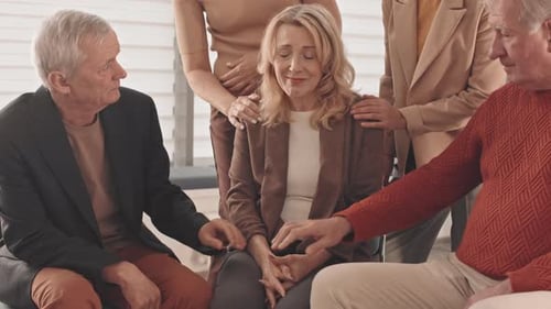 Woman Receives Comfort from Friends During Difficult Time