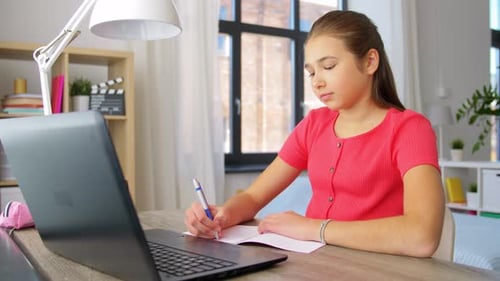 Teenage Student Studying At Desk