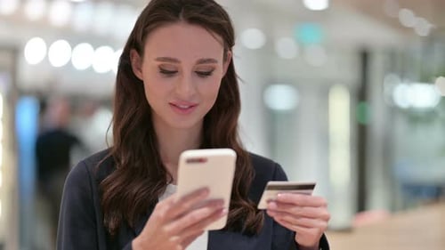 Woman Enters Credit Card Information on Smartphone