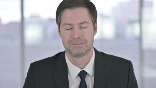 Smiling Man in Suit Looking at Camera