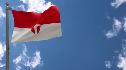 Waving Red and White Flag with Cross Shield Against Blue Sky