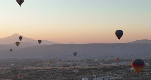 Aerial Cinematic Drone View of Colorful Hot Air Balloon Flying Over Cappadocia