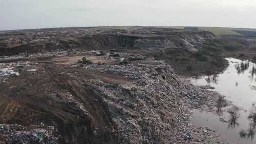 Aerial View on City Garbage Dump with Flocks of Birds