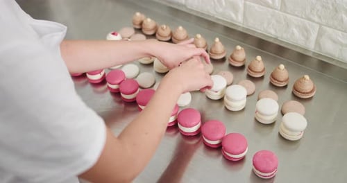 Typical Process of Connecting Two Halves of Macaron with Cream Filling Inside in