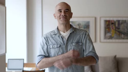 Smiling Man Poses Indoors
