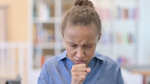 Portrait of Sick African Woman Coughing