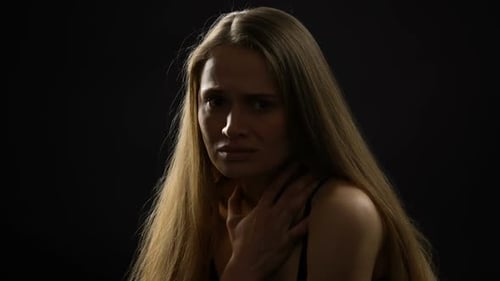 Frightened Woman Looking to Camera, Domestic Violence Victim Waiting for Help