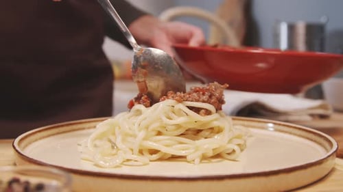 Sauce Being Served on Pasta Spaghetti Plate