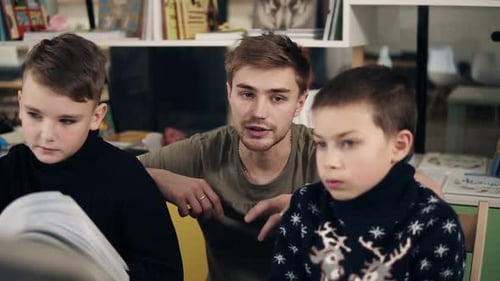 Teacher Explaining Lesson to Eager Students