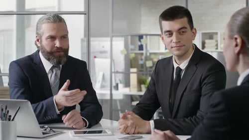 Business People Meeting in Office to Close Deal