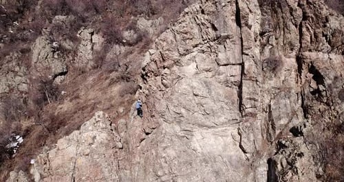 A Group of People are Engaged in Rock Climbing