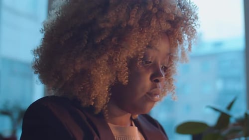 African American Businesswoman Using Laptop in Office