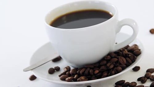 Coffee Cup with Coffee Beans Close Up