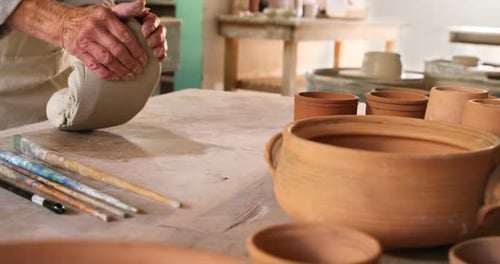 Hands Kneading Clay to Prepare Pottery