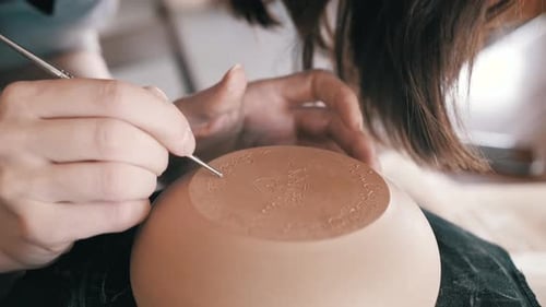 Artist Etches Details on Delicate Clay Bowl