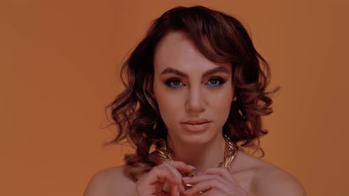 Glamorous Woman Posing with Gold Chain