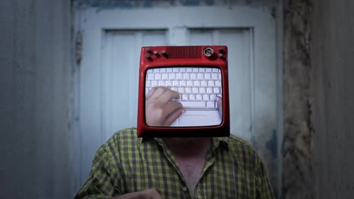 Person with TV Head Typing on Keyboard Screen
